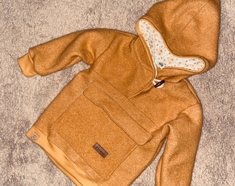 Outdoor hoodie made of boiled wool in mustard yellow and flowers for babies and children