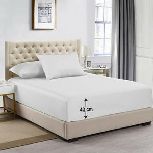 May include: White fitted sheet with a 40 cm drop, shown on a bed with a tufted headboard and two white pillows.