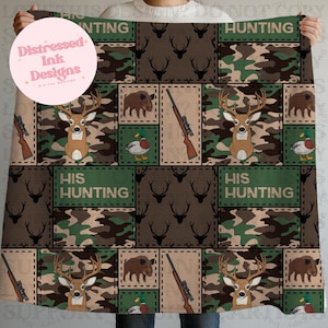 May include: A camouflage-patterned blanket with hunting-themed imagery. The design includes deer, rifles, ducks, and wild boars, with the text "HUNTING" and "HIS HUNTING" in green blocks. The blanket is a mix of brown, green, and tan colors.