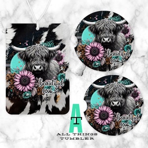 May include: A set of two round coasters featuring a highland cow with a floral design and the text "beautiful soul". The coasters have a black and white cowhide pattern background with a turquoise blue circle and white flowers.