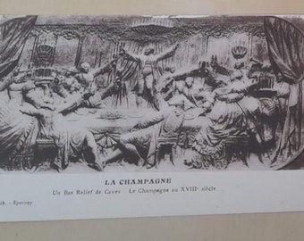 May include: Four vintage postcards depicting scenes from the Champagne region of France. The postcards feature black and white images of a building, a town, a sculpture, and a vineyard.