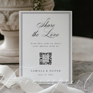 May include: A white card with black text that reads "Share the Love" and "Scan this code to share your photos with us." The card includes a QR code and the names "CAMILLA & OLIVER" with the date "June 15, 20xx."