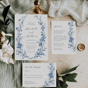May include: A wedding invitation with blue floral designs. The invitation is for Kendall and William, and the wedding will be held on Saturday, July 14th at The Ritz Carlton in Miami, Florida. The invitation includes details about the ceremony and reception, as well as a RSVP card.