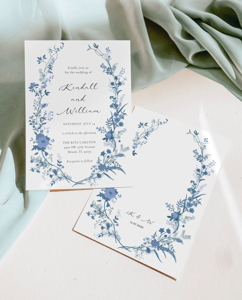 May include: Wedding invitation with a floral design in shades of blue. The invitation reads "Kindly join us for the wedding of Kendall and William, Saturday, July 14, 2 o'clock in the afternoon, The Ritz Carlton, 3300 SW 17th Avenue, Miami, FL 33155, Reception to follow".