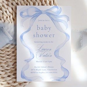 May include: A light blue watercolor baby shower invitation with a large blue bow and the text "Join us for a baby shower honoring mom-to-be Lauren Watson March 15 at 4 pm Rachel Adam's House 2074 Maple Lane, Charleston. RSVP to Sophie 333.444.5555"