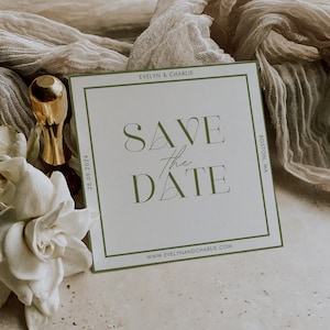 May include: A white save the date card with a green border. The text on the card reads "Save the Date" in a stylized font. The date "28.09.2024" is printed on the left side of the card. The names "Evelyn & Charlie" are printed at the top of the card. The text "Boston, MA" is printed on the right side of the card. The website "www.evelynandcharlie.com" is printed at the bottom of the card.