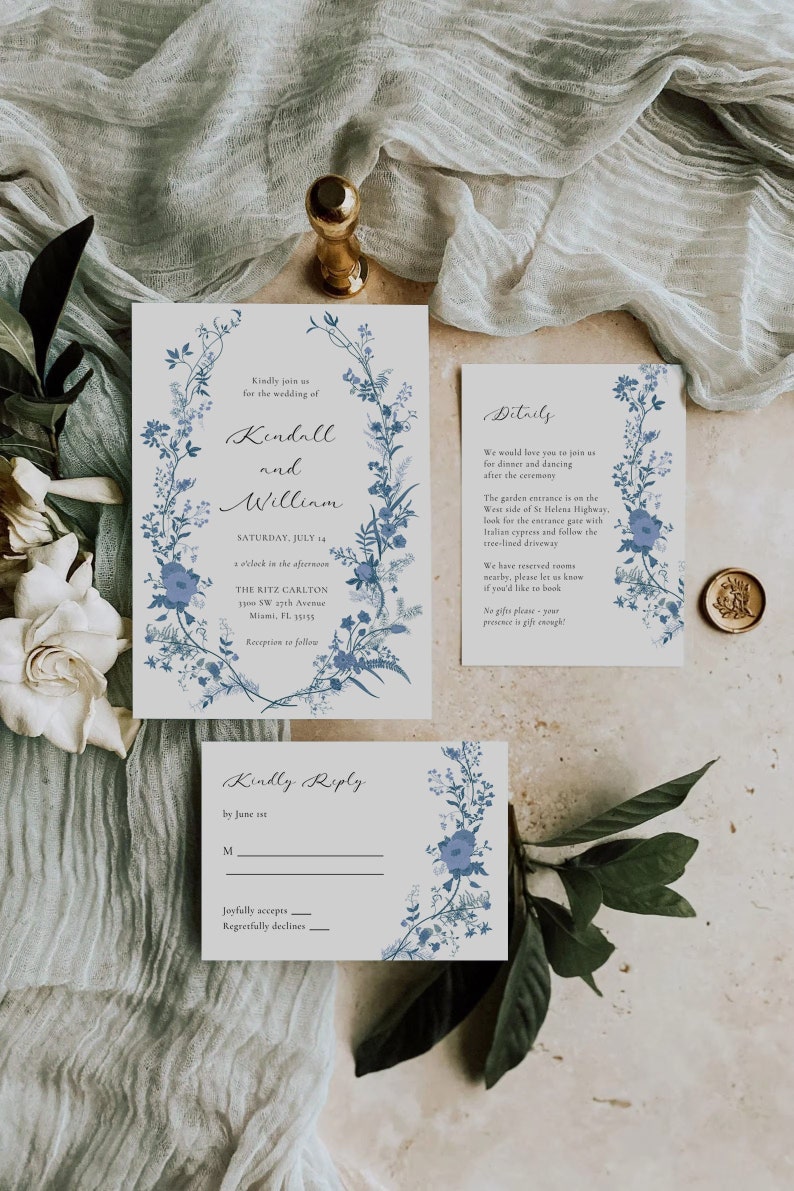 May include: A wedding invitation with blue floral designs. The invitation is for Kendall and William, and the wedding will be held on Saturday, July 14th at The Ritz Carlton in Miami, Florida. The invitation includes details about the ceremony and reception, as well as a RSVP card.