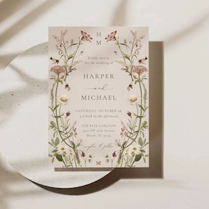 May include: A wedding invitation with a floral design featuring pink and white flowers. The invitation reads "Kindly join us for the wedding of Harper and Michael, Saturday, October 28, 3 o'clock in the afternoon, The Ritz Carlton, 3300 SW 27th Avenue, Miami, FL 33155, reception to follow."
