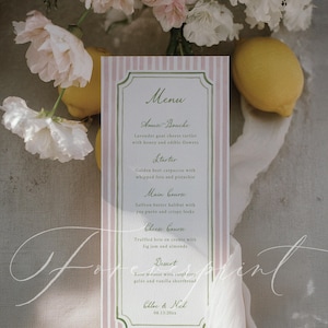 May include: A menu card with a pink and white striped background, featuring a green border and elegant script. The menu lists courses like Amuse-Bouche, Starter, Main Course, Cheese Course, and Dessert. Lemons and flowers are in the background.