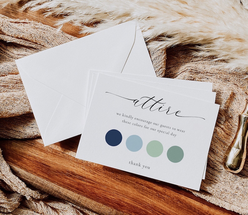 May include: A white card with the word "attire" written in cursive. The card also includes the text "we kindly encourage our guests to wear these colors for our special day" and a color palette of four circles in shades of blue and green. The card ends with the text "thank you".