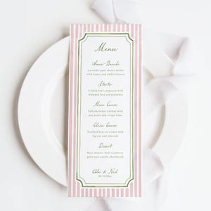 May include: A vertical menu card with a pink and white striped background, featuring a decorative green border. The menu lists courses like Amuse Bouche, Starter, and Dessert, with detailed descriptions. The names "Chloe & Nick" and a date are at the bottom.