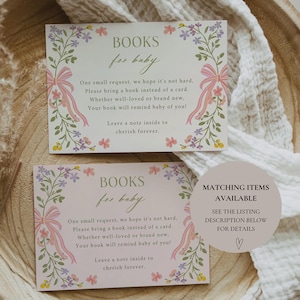 Op de afbeelding: Twee roze en witte kaarten met bloemenmotieven en de tekst "BOOKS for baby". De kaarten vragen gasten om een boek mee te nemen in plaats van een kaart voor de baby. De tekst zegt ook "Laat een briefje achterin om voor altijd te koesteren".