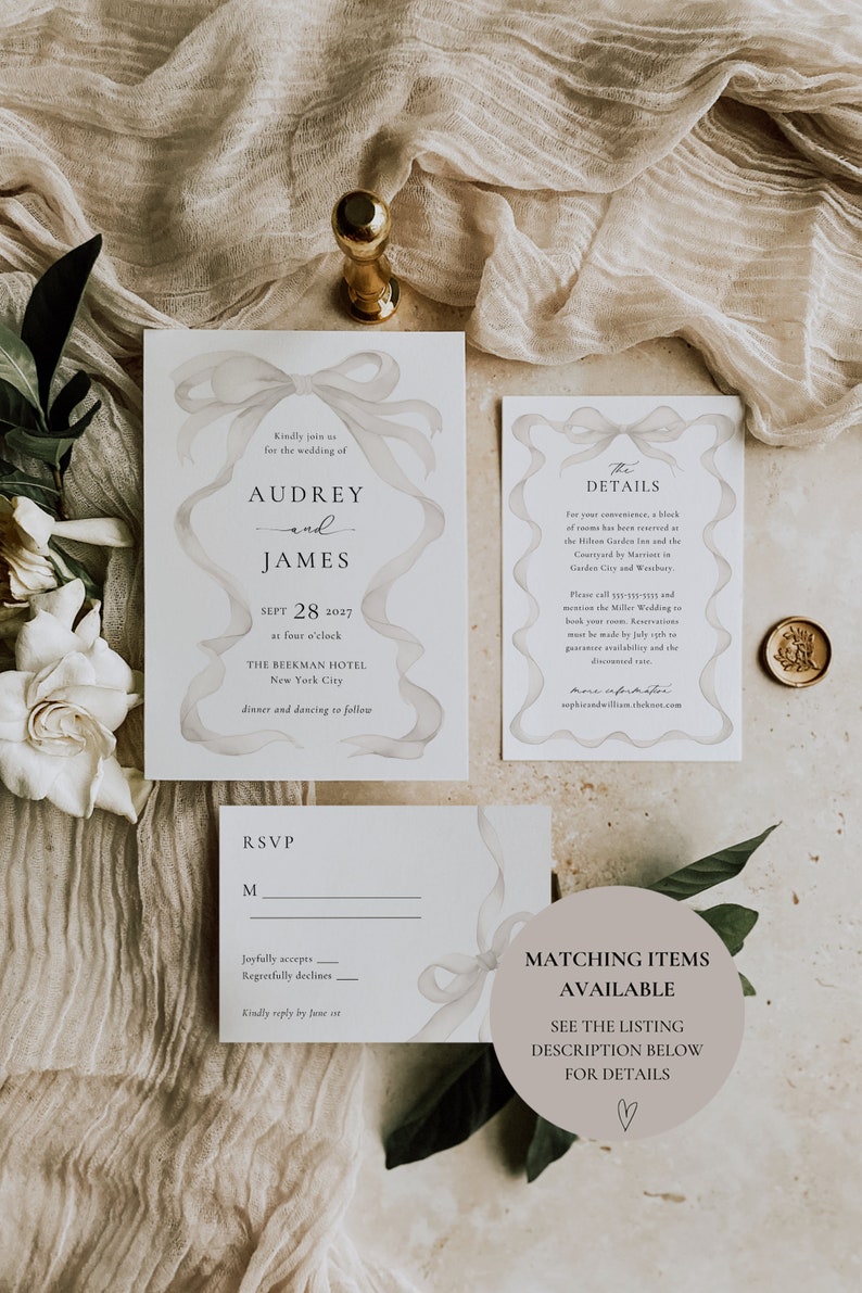May include: A wedding invitation suite with a watercolor design of a white ribbon bow. The invitation includes the names Audrey and James, the date September 28, 2027, and the location The Beekman Hotel in New York City. The RSVP card includes a space for the guest's name and a line for them to indicate if they will be attending. The details card includes information about the wedding, including the hotel block and contact information. The final card states "Matching Items Available" and directs the reader to the listing description for details.