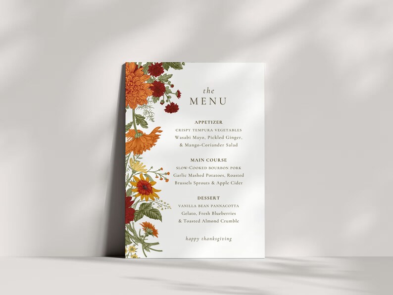Pu&ograve; includere: Un menu del Ringraziamento con un bordo floreale. Il menu include antipasti, piatto principale e dessert. Il testo recita: "the MENU, APPETIZER, CRISPY TEMPURA VEGETABLES, Wasabi Mayo, Pickled Ginger, & Mango-Coriander Salad, MAIN COURSE, SLOW-COOKED BOURBON PORK, Garlic Mashed Potatoes, Roasted Brussels Sprouts & Apple Cider, DESSERT, VANILLA BEAN PANNACOTTA, Gelato, Fresh Blueberries & Toasted Almond Crumble, happy thanksgiving"