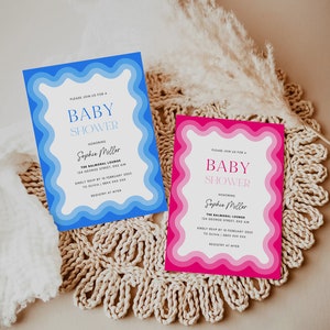 May include: Two baby shower invitations with a wavy border. The invitation on the left is blue and the invitation on the right is pink. Both invitations say "Please join us for a Baby Shower" and "Honoring Sophie Miller".