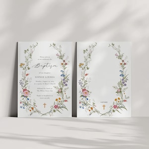 May include: A floral baptism invitation with a wreath of colorful flowers and greenery. The text reads "Please join us as we celebrate the Baptism of our daughter Sophie Linnea Monday, August 15, 2022 at 11:00 am St. Mary's Church followed by lunch at The White Horse Inn Reply to Stephanie by August 1st"