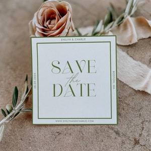 May include: A white save the date card with a green border. The text on the card reads "Save the Date" with a green triangle design. The card also includes the names "Evelyn & Charlie", the date "28.09.2024", the location "Boston, MA", and the website "www.evelynandcharlie.com".