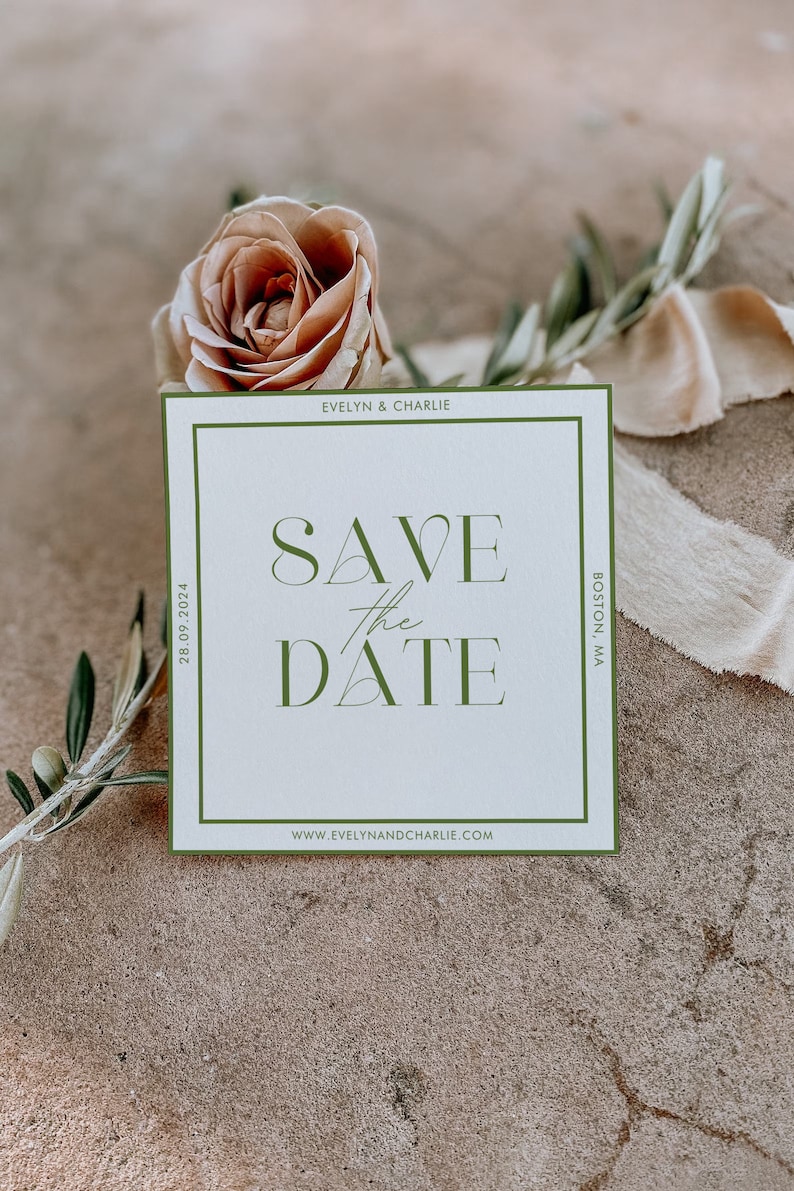 May include: A white save the date card with a green border. The text on the card reads "Save the Date" with a green triangle design. The card also includes the names "Evelyn & Charlie", the date "28.09.2024", the location "Boston, MA", and the website "www.evelynandcharlie.com".
