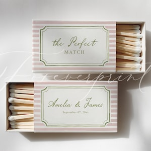 May include: Two open matchboxes with pink and white striped patterns. The top box reads "the Perfect MATCH" in elegant script. The bottom box is personalized with "Amelia & James" and a date.