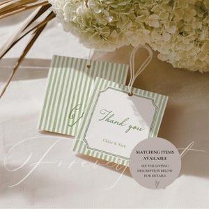 May include: Two gift tags with a green and white striped pattern and the words "Thank you" in elegant script. The tags are tied with string and have the names "Chloe & Nick" printed below the message. A circular graphic states "Matching Items Available".
