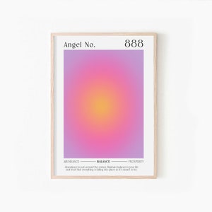 May include: A framed print with a gradient background of pink, purple, and yellow. The text "Angel No. 888" is at the top. Below the gradient is text that reads "ABUNDANCE - BALANCE - PROSPERITY". The text below reads "Abundance is just around the corner."