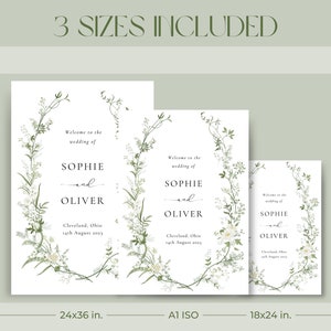 Pode incluir: Tr&ecirc;s modelos de cartazes de casamento imprim&iacute;veis com um design de coroa de flores. Os cartazes dizem "Bem-vindos ao casamento de Sophie e Oliver" com a data e o local. Os tamanhos s&atilde;o 61x91 cm, A1 ISO e 46x61 cm.