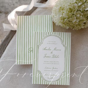 May include: Wedding invitation with a green and white striped pattern. The text reads "Save the date for the wedding of Amelia Morris & James Blake, Saturday, August 8th, 2026". A bouquet of white flowers and ribbon are in the background.