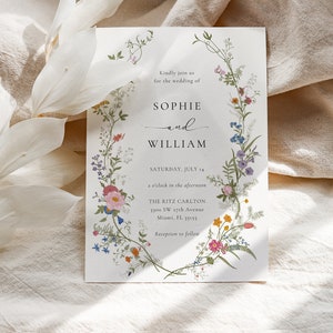 May include: Wedding invitation with a floral border. The invitation is for Sophie and William, and it states the wedding will be held on Saturday, July 14 at 2 o'clock in the afternoon at The Ritz Carlton in Miami, Florida.