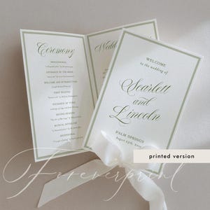 May include: A folded wedding program printed on white cardstock with sage green borders and elegant dark green script text. The front cover reads Welcome to the wedding of Scarlett and Lincoln, Palm Springs, August 25th, 20XX, tied with a white ribbon.
