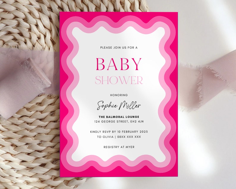May include: Pink and white baby shower invitation with a wavy border. The invitation says "Please join us for a Baby Shower honoring Sophie Miller. The Balmoral Lounge, 124 George Street, EH2 4JN. Kindly RSVP by 10 February 2023 to Olivia 08XX XXX XXX. Registry at Myer."