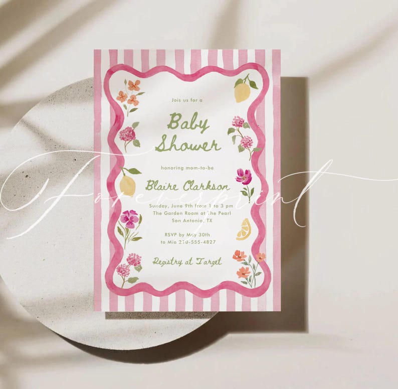 May include: A watercolor baby shower invitation with a pink and white striped background. The invitation features floral and lemon illustrations, with text that reads "Baby Shower" and details for the event.