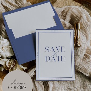 May include: A wedding invitation suite featuring a navy blue envelope and a matching card with the text "Save the Date." The card has a navy blue border and includes the date and location. A gold wax seal is also present.