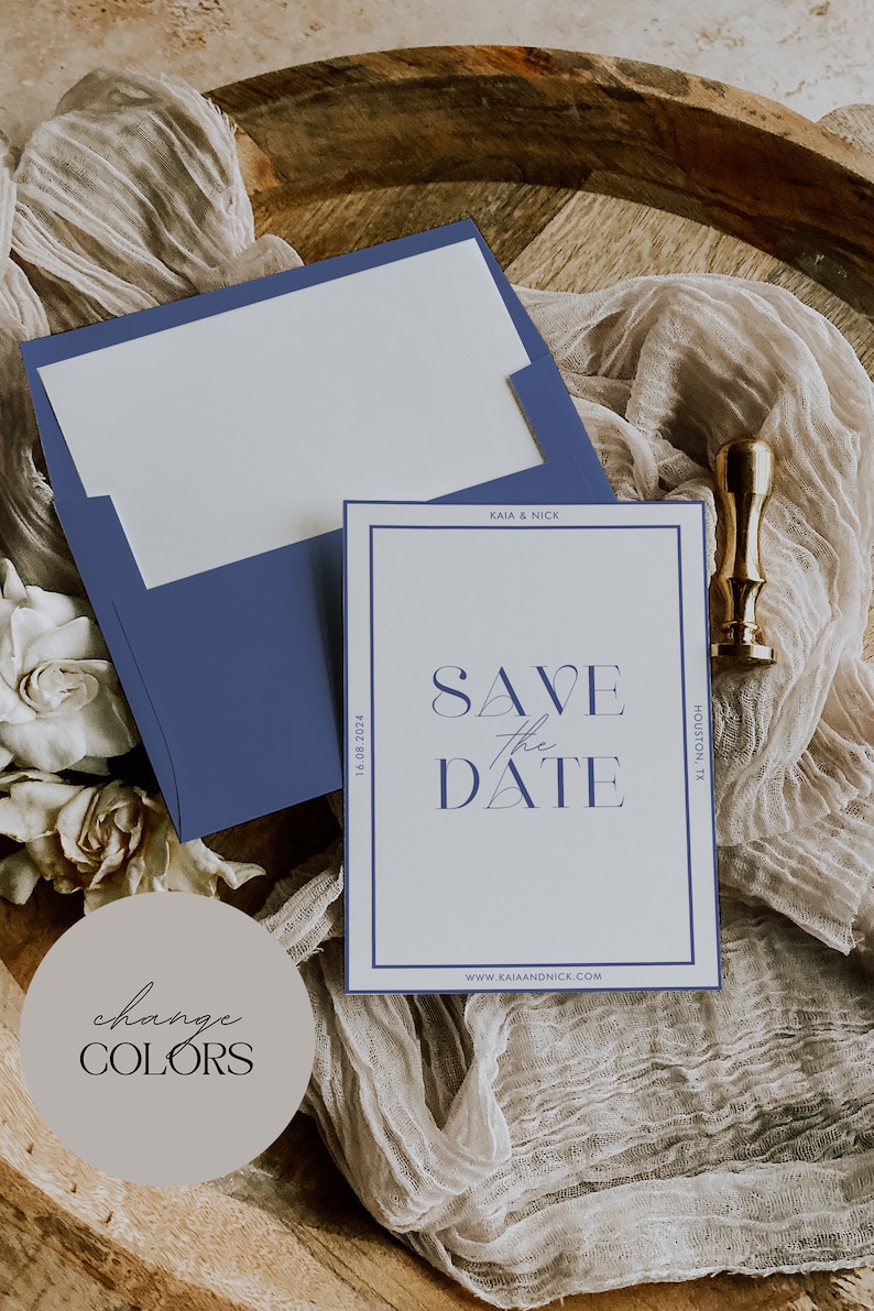 May include: A wedding invitation suite featuring a navy blue envelope and a matching card with the text "Save the Date." The card has a navy blue border and includes the date and location. A gold wax seal is also present.