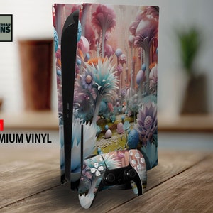May include: A video game console and controller skin featuring a colorful fantasy landscape design. The design includes pink, blue, and white flora. The console and controller are on a wooden surface. The text "WUNDERBAR SKINS" and "3M PREMIUM VINYL" are visible.