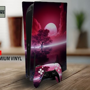 May include: A PlayStation 5 console with a custom skin featuring a red and pink landscape with a tree and a large moon. The matching controller also has the same design. The words "Wunderbar Skins" and "3M Premium Vinyl" are visible.