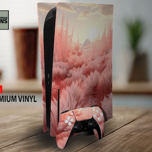 May include: A PlayStation 5 console and controller skin featuring a pink and white landscape design. The skin covers the console and controller with a repeating pattern of a sunset over a field of tall grass. The text "WUNDERBAR SKINS" and "3M PREMIUM VINYL" are visible.