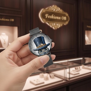 May include: A black wristwatch with a mesh band. The watch face features a steampunk design with a blue top hat, gears, and a skull. The background includes the text "Feshions OB".