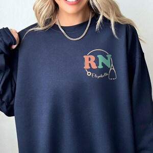 Custom Registered Nurse Sweatshirt With Name, Personalized RN Pocket Hoodie, Nurse Life Outfit, Nurse Appreciation Clothing, Cute Nurse Gift
