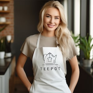 a woman wearing an apron with a teapot on it