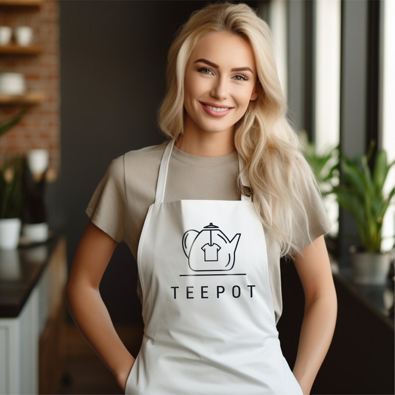 a woman wearing an apron with a teapot on it