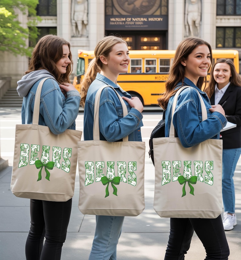 Three young women standing on a sidewalk, each carrying a beige tote bag with the word "SEARS" printed on it. They are smiling and appear to be enjoying their time together.