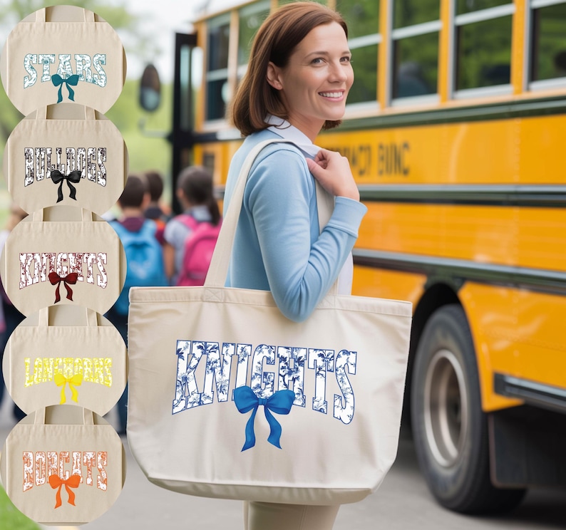 A woman is standing in front of a yellow school bus, smiling and holding a large tote bag with the word "KNIGHTS" printed on it.
