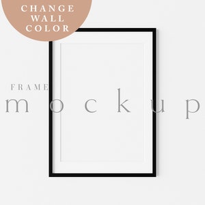 Peut inclure: Une maquette de cadre photo noir sur un mur blanc. Le cadre est vide et prêt pour votre design.