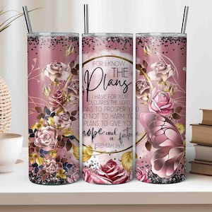 May include: A pink and gold tumbler with a floral design and a butterfly. The tumbler has a quote from Jeremiah 29:11 that reads "For I know the plans I have for you, declares the Lord, plans to prosper you and not to harm you, plans to give you hope and a future."