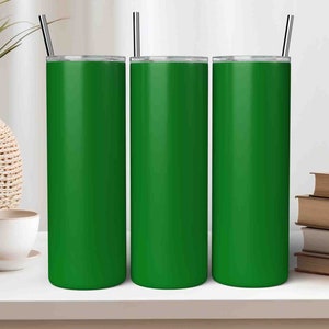 May include: Three green stainless steel tumblers with lids and straws. The tumblers are on a white surface.