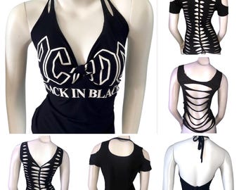 May include: A black halter top featuring the white text AC/DC and BACK IN BLACK on the front. The garment is shown in multiple views, displaying various cut-out designs on the back, including horizontal slits and open-shoulder styles with ties.