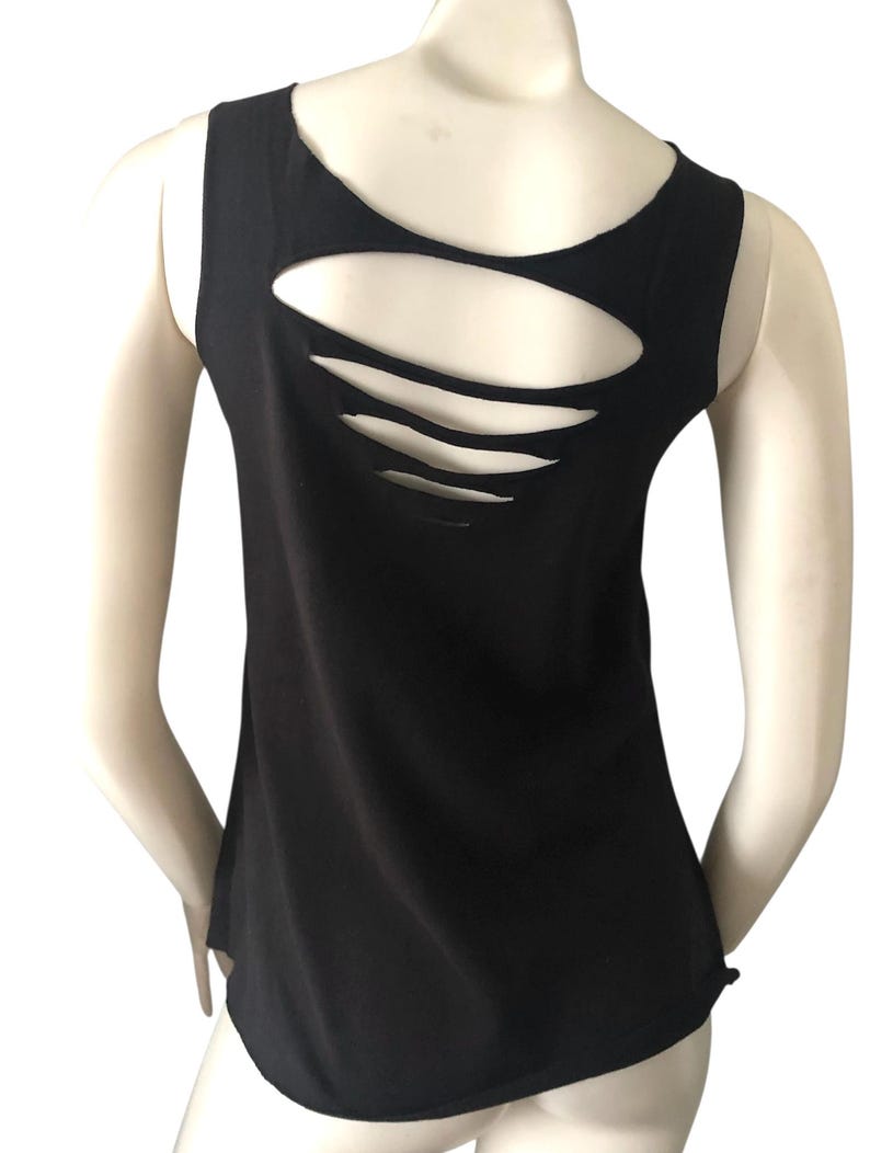 May include: Black tank top with a unique back design. The back of the top features several horizontal cut-out slits, adding a stylish and edgy detail. The sleeveless design and round neckline offer a classic silhouette.
