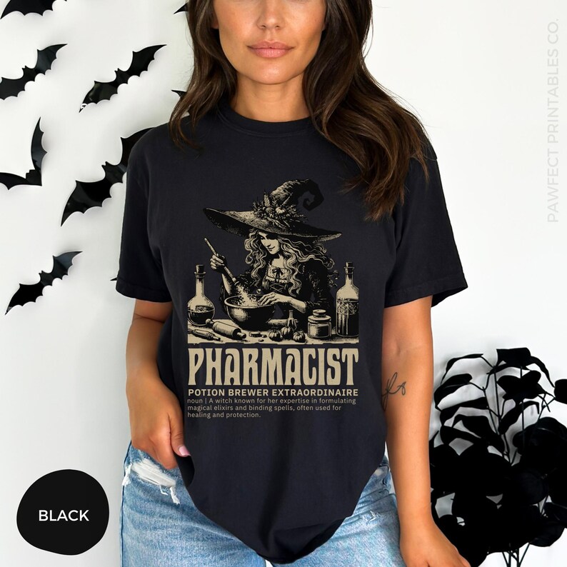 May include: Black t-shirt with a graphic of a witch brewing a potion in a cauldron. The text "Pharmacist Potion Brewer Extraordinaire" is printed below the image. A witch known for her expertise in formulating magical elixirs and binding spells, often used for healing and protection.