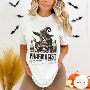May include: White t-shirt with a graphic of a witch brewing a potion. The text "Pharmacist Potion Brewer Extraordinaire" is below the image. The definition of the term is also included.