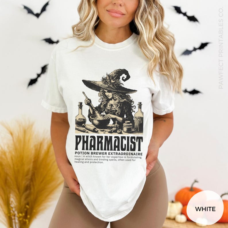 May include: White t-shirt with a graphic of a witch brewing a potion. The text "Pharmacist Potion Brewer Extraordinaire" is below the image. The definition of the term is also included.